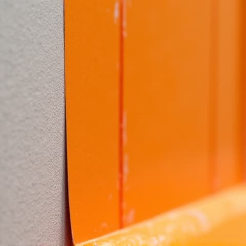 Detailed view of a Schluter-Kerdi waterproofing system being installed during a tub-to-shower conversion in Converse, TX, ensuring a leak-proof and durable finish.
